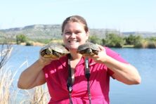 image of Lauren holding 2 turtles